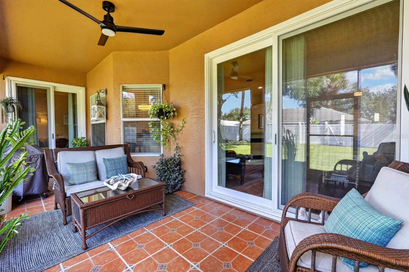 Covered, screened rear lanai with 3 points of  access to the home