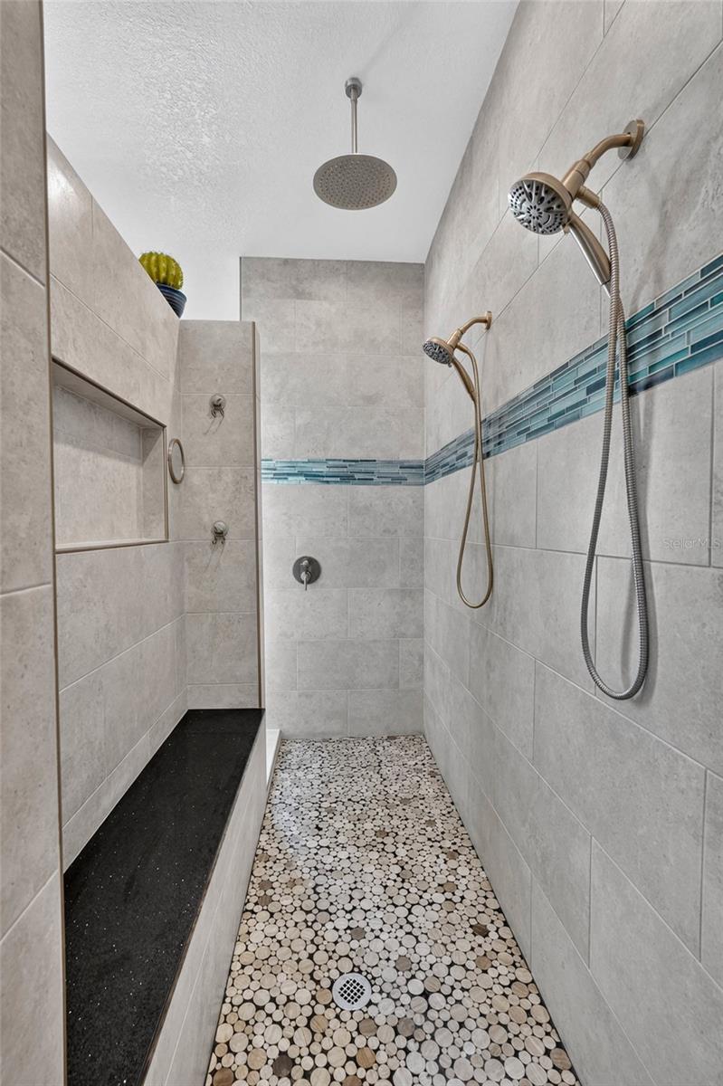 Built in bench seat and large shower niche