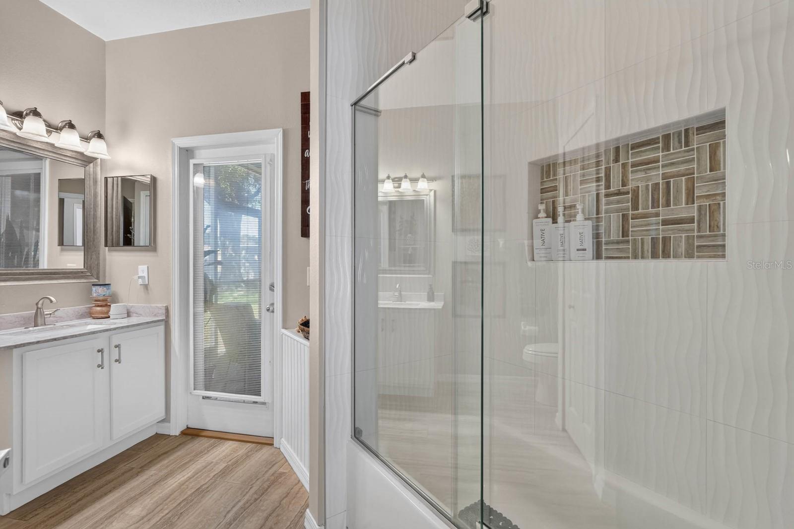 Beautiful guest bathroom wth access to rear patio
