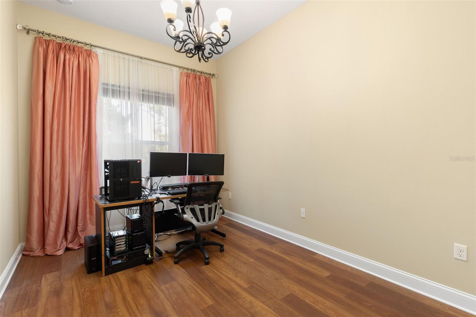 First-Floor Bedroom #3 is currently used as a home office, offering a versatile space that can easily accommodate a variety of needs.
