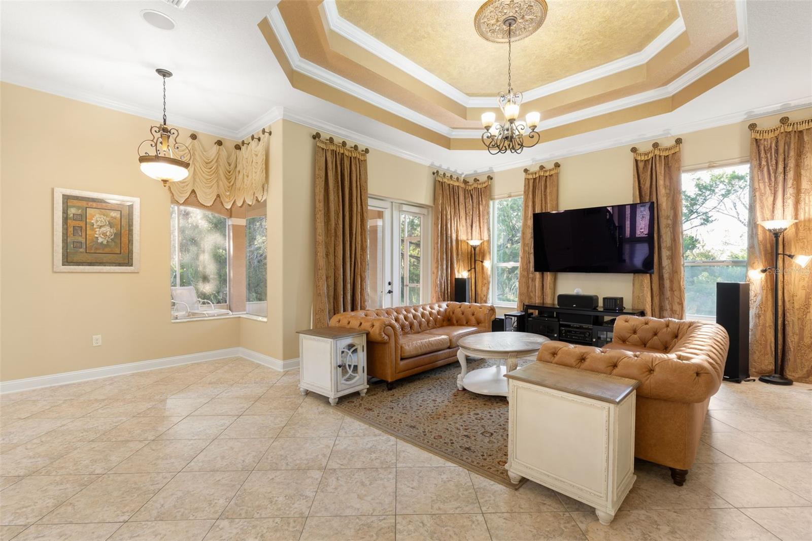 Generous floor space, beautiful natural light and architectural details make this gathering room a comfortable place to unwind or enjoy time with guests.