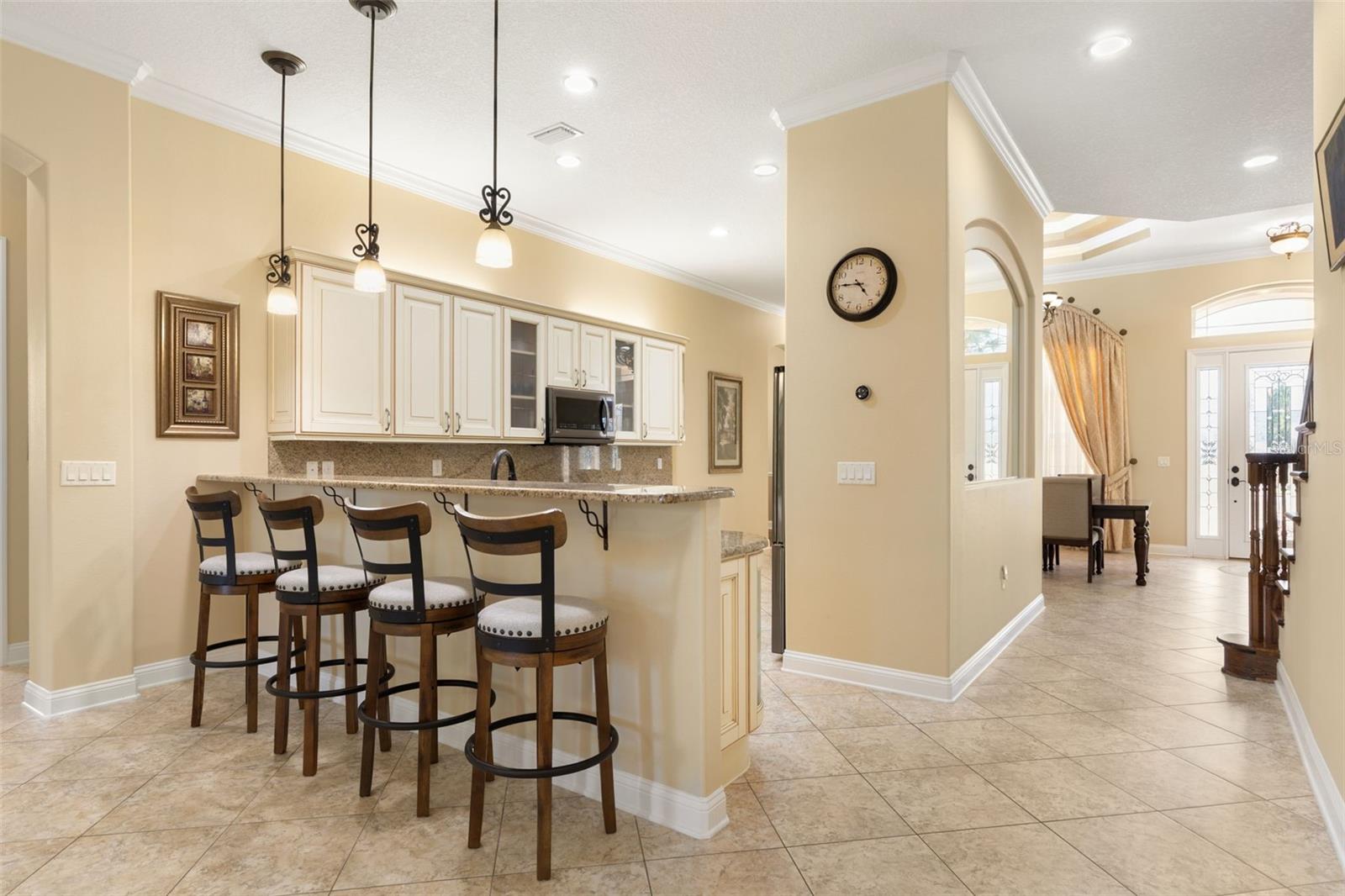An inviting connection between the kitchen and gathering room creates a welcoming setting for conversation, entertaining and everyday living.
