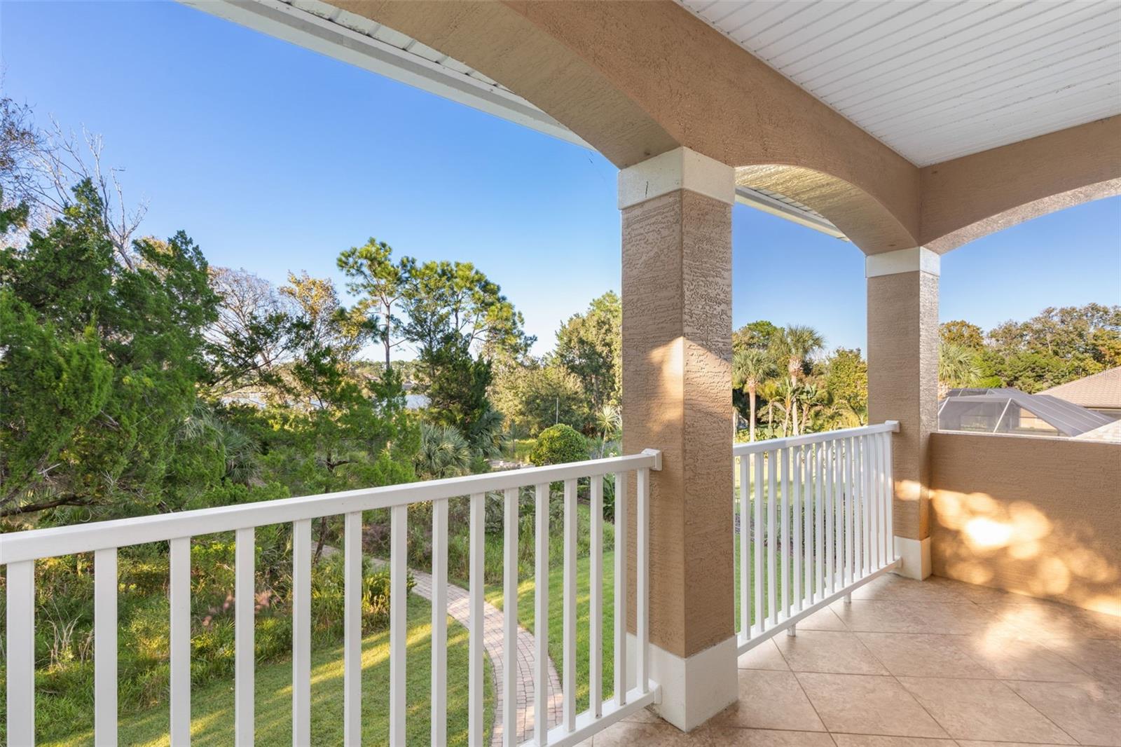 Step onto the private covered balcony and enjoy the peaceful natural surroundings, with glimpses of Emerald Lake through the trees.