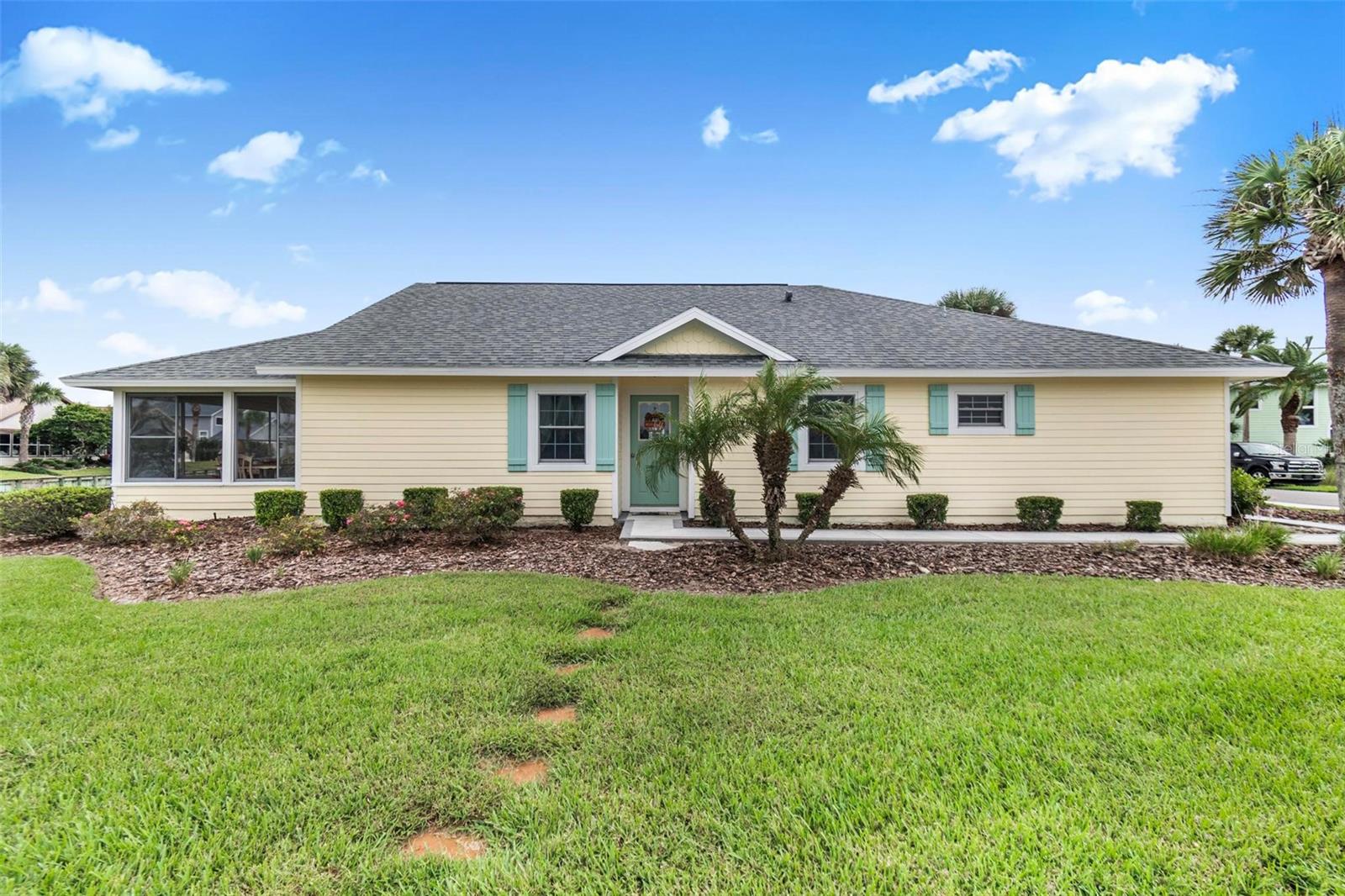 Front of house facing lake and fountain