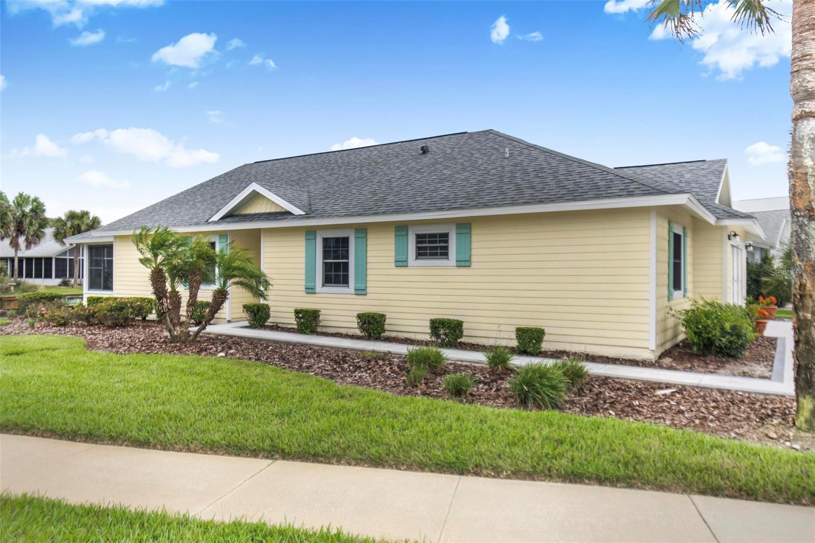 Front of house facing lake with fountain