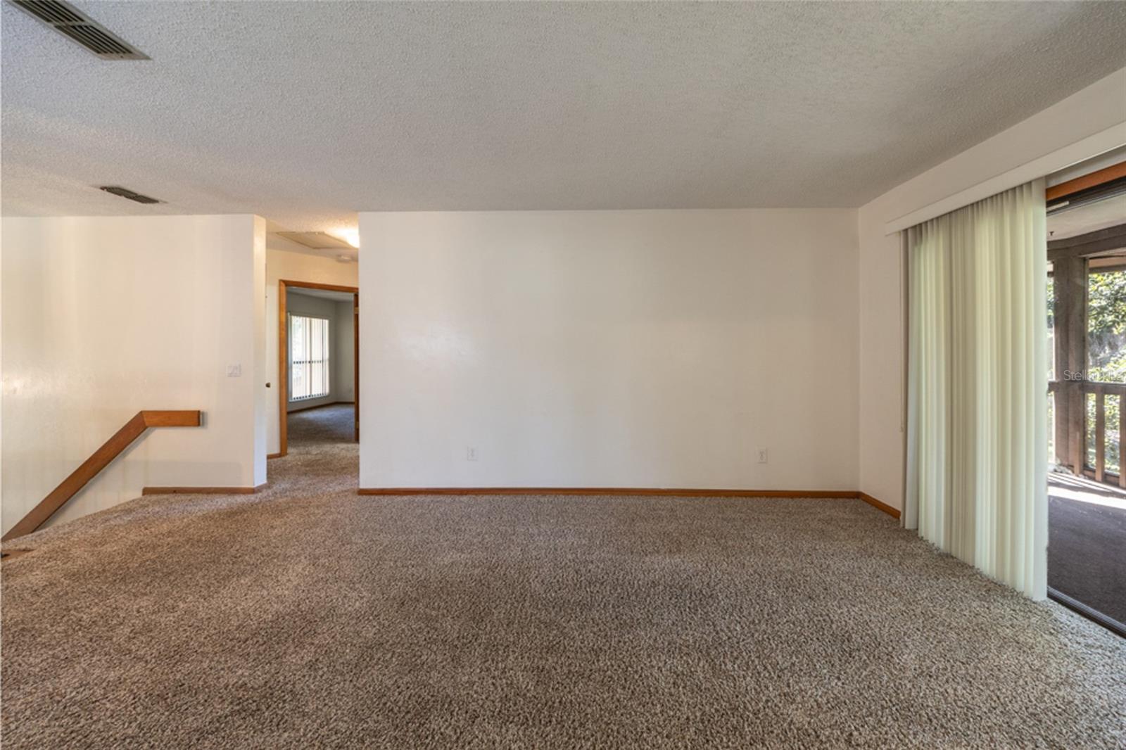 UNSTAGED: Carpeted Living Area.  Professionally Cleaned