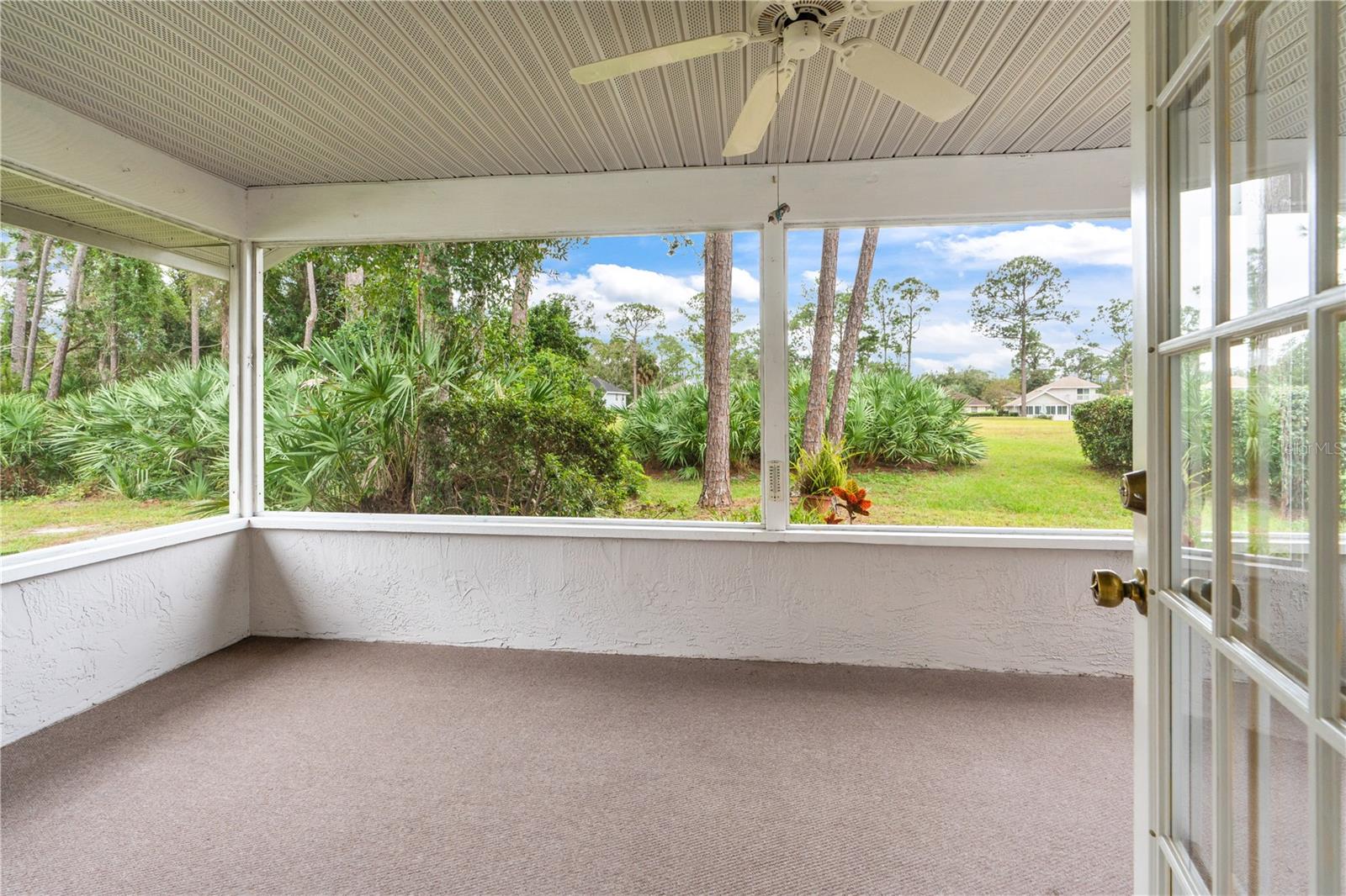 Screened Porch Overlooks Backyard