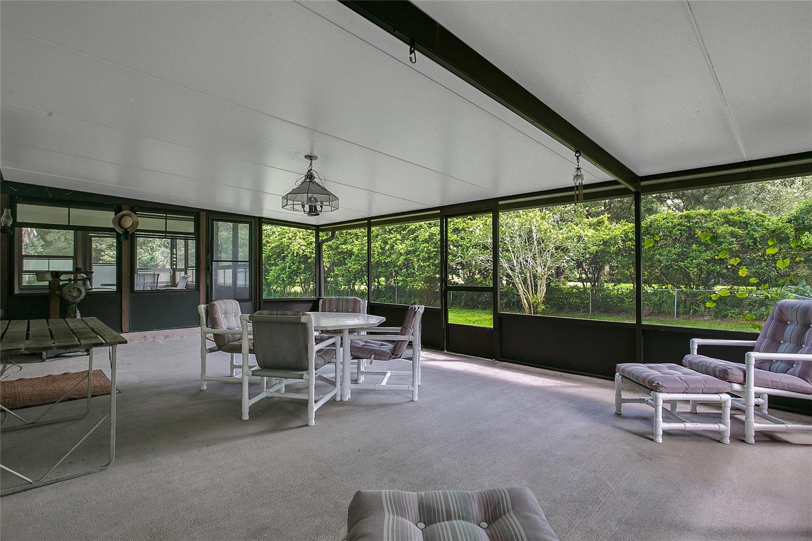 1 of 2 large outdoor covered porch/living area