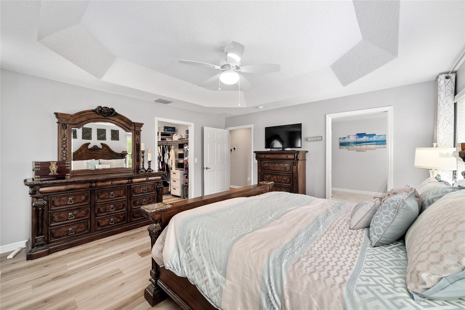 The space is elevated with a tray ceiling and overhead lighting The space is elevated with a tray ceiling and overhead lighting