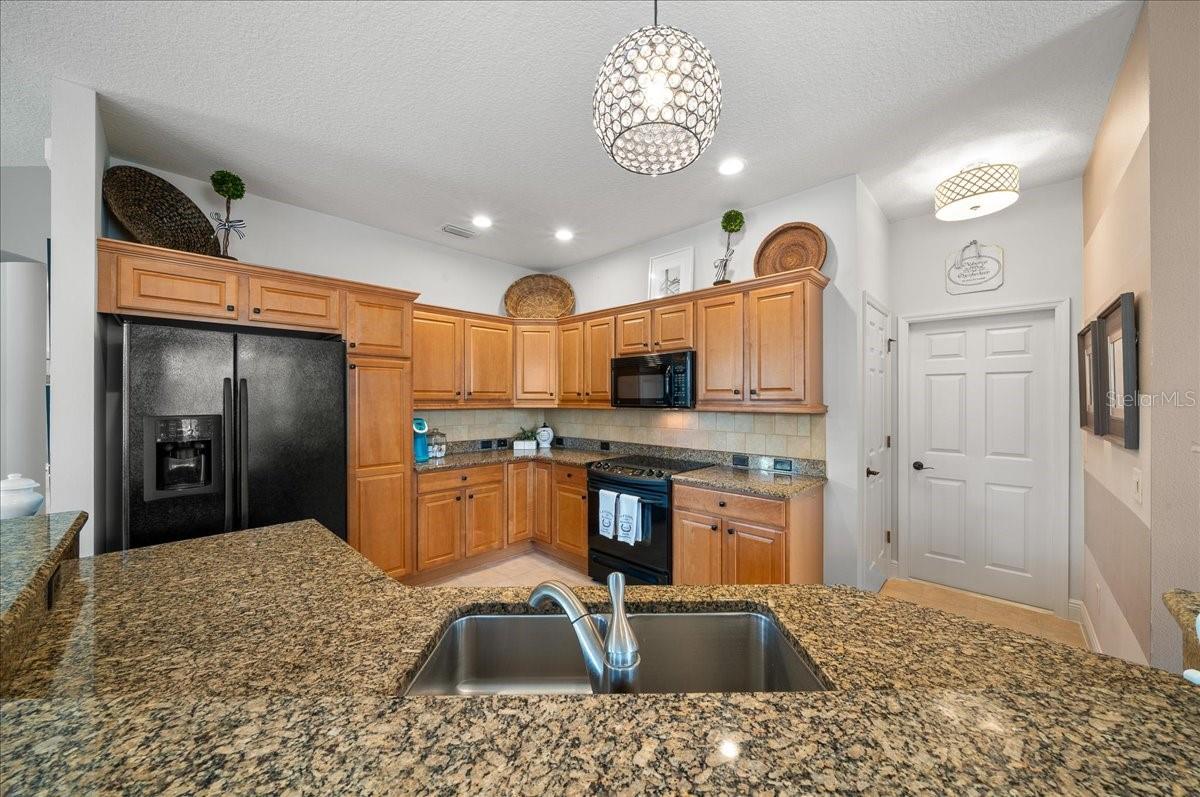 Kitchen Features Water-Fall Island w/ Granite Countertops