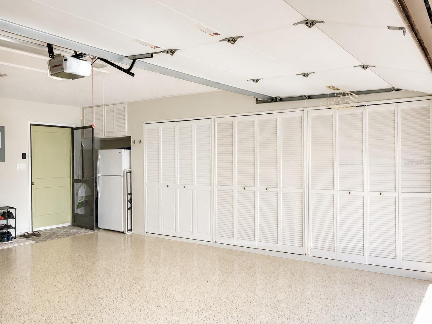 Garage: Wall-to-Wall Storage & Kitchen Entry