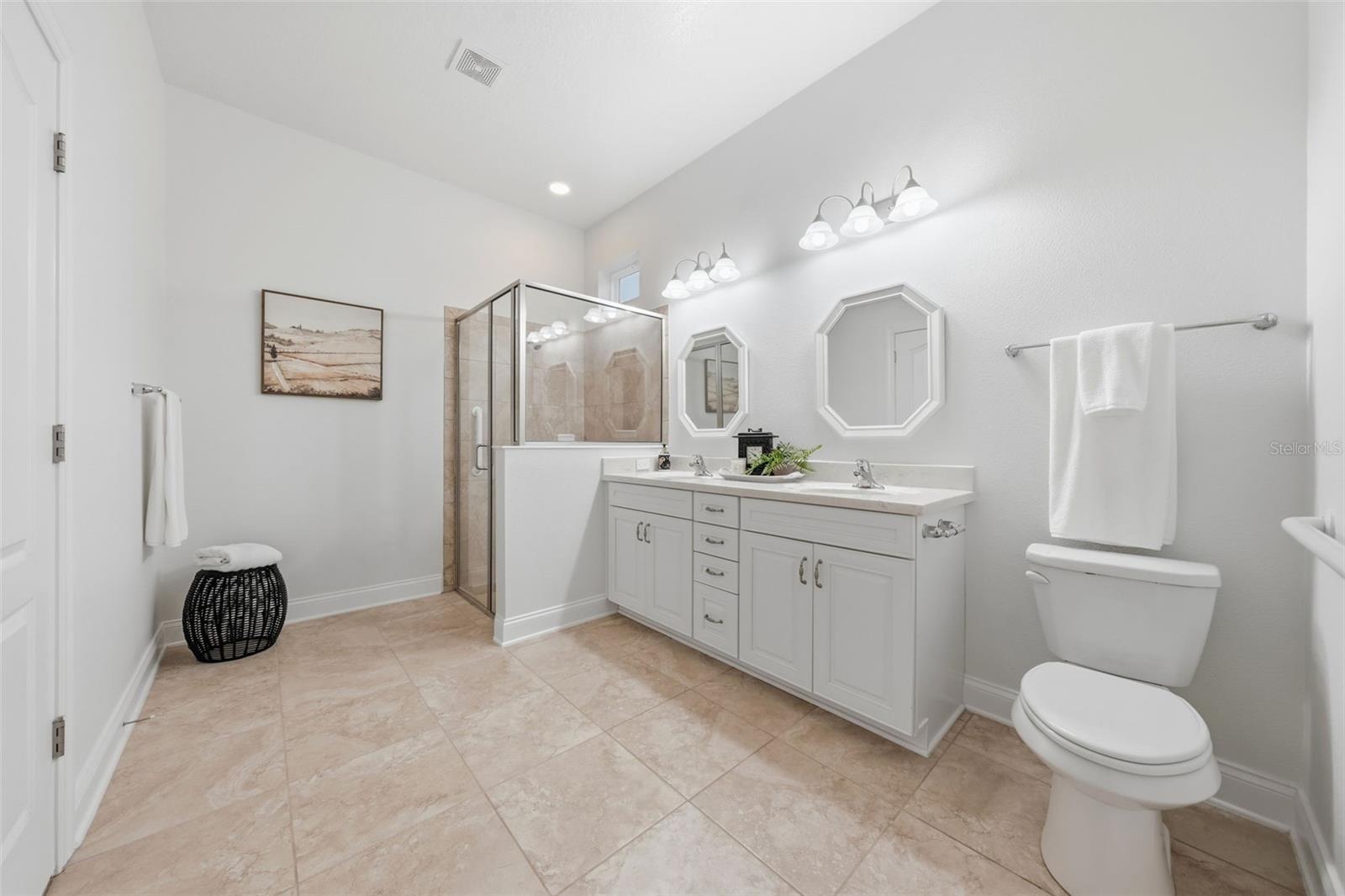 Primary bathroom with tiled walk-in shower Primary bathroom with tiled walk-in shower