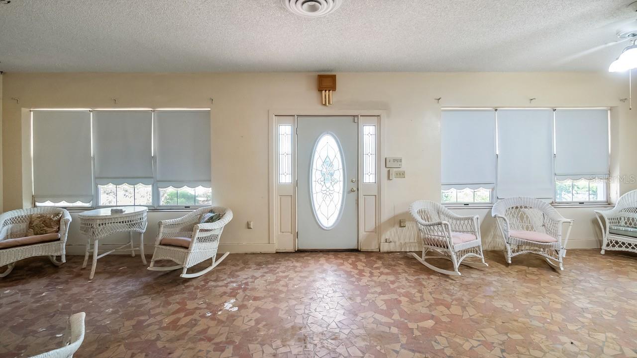 Front enclosed porch with terrazzo flooring