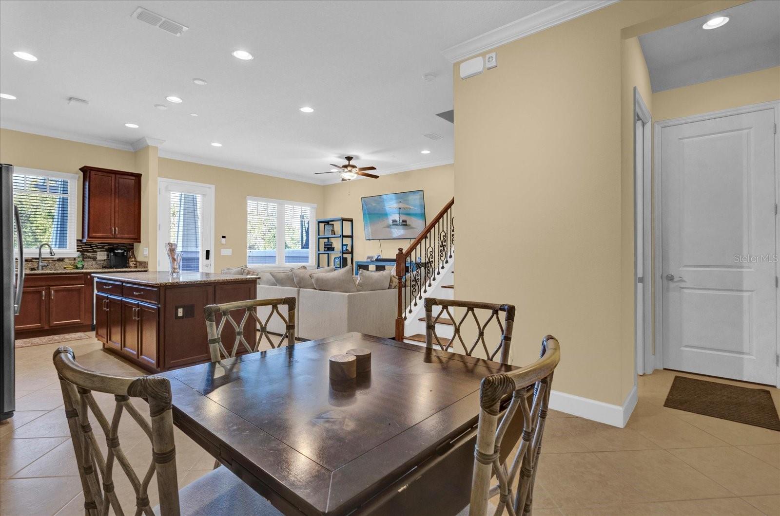 Dining space with room for a full table, flowing seamlessly from the kitchen.