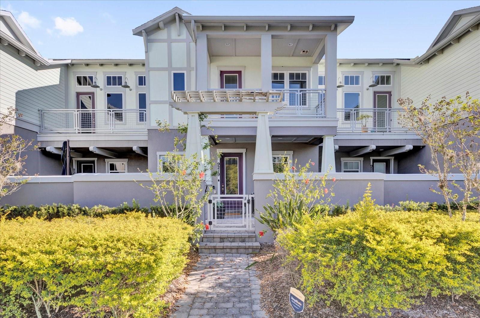 Charming Lake Nona townhome with classic curb appeal in the desirable Laureate Park community.