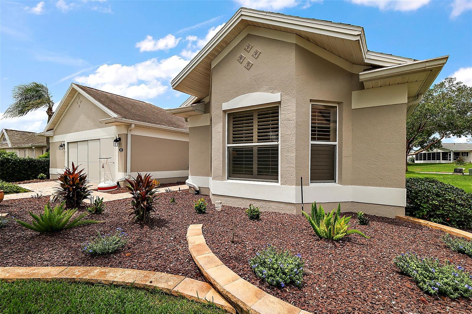 Lovely landscaping surrounding the home. Lovely landscaping surrounding the home.