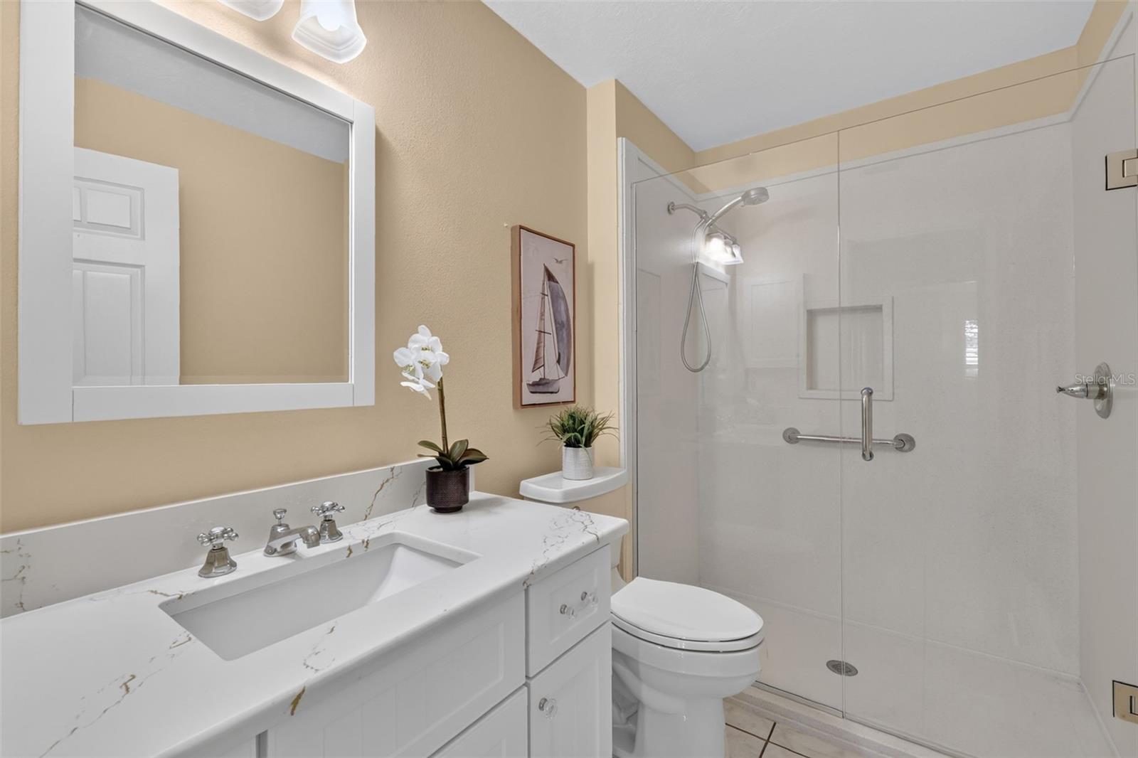 Guest bathroom with walk in shower and Quartz countertop