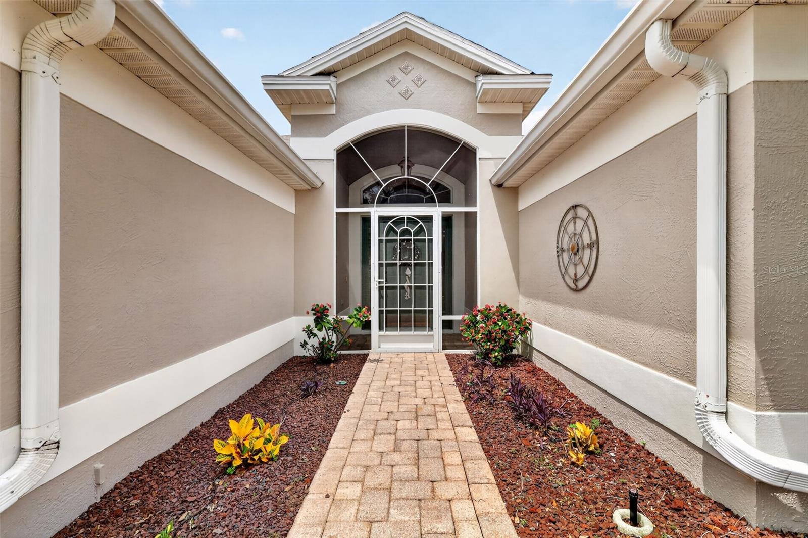 Paver walk leads to the screened in entrance. Paver walk leads to the screened in entrance.