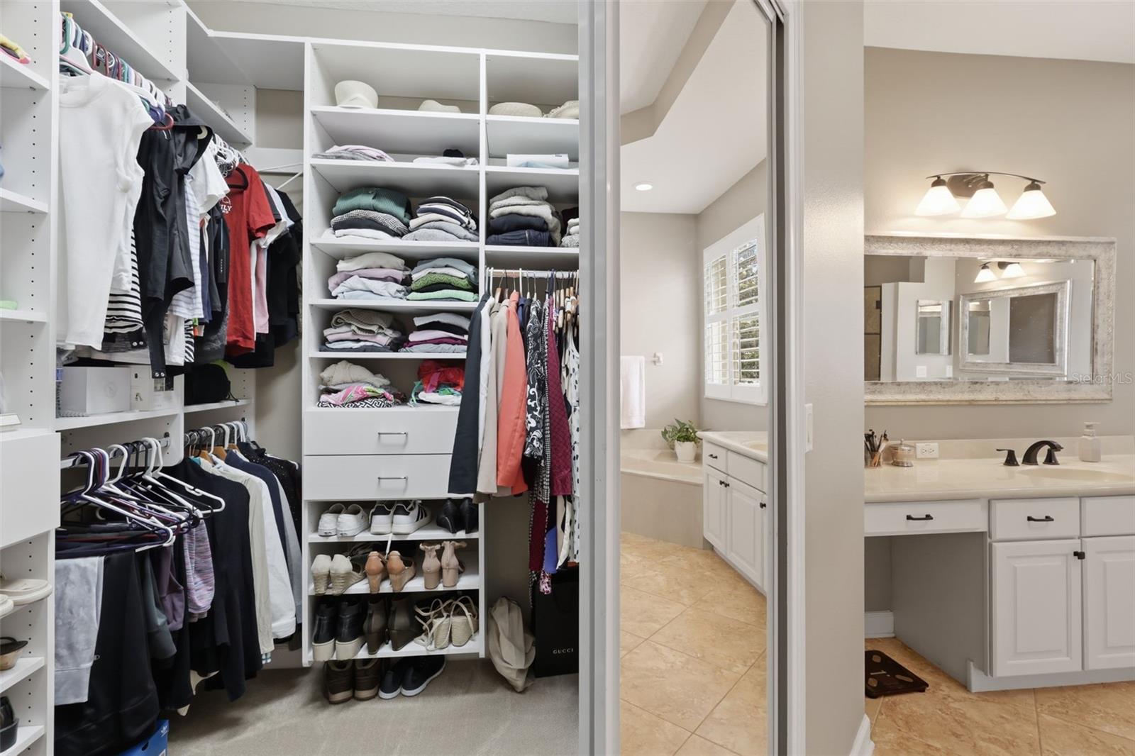 One of the 2 primary bedroom custom closets.