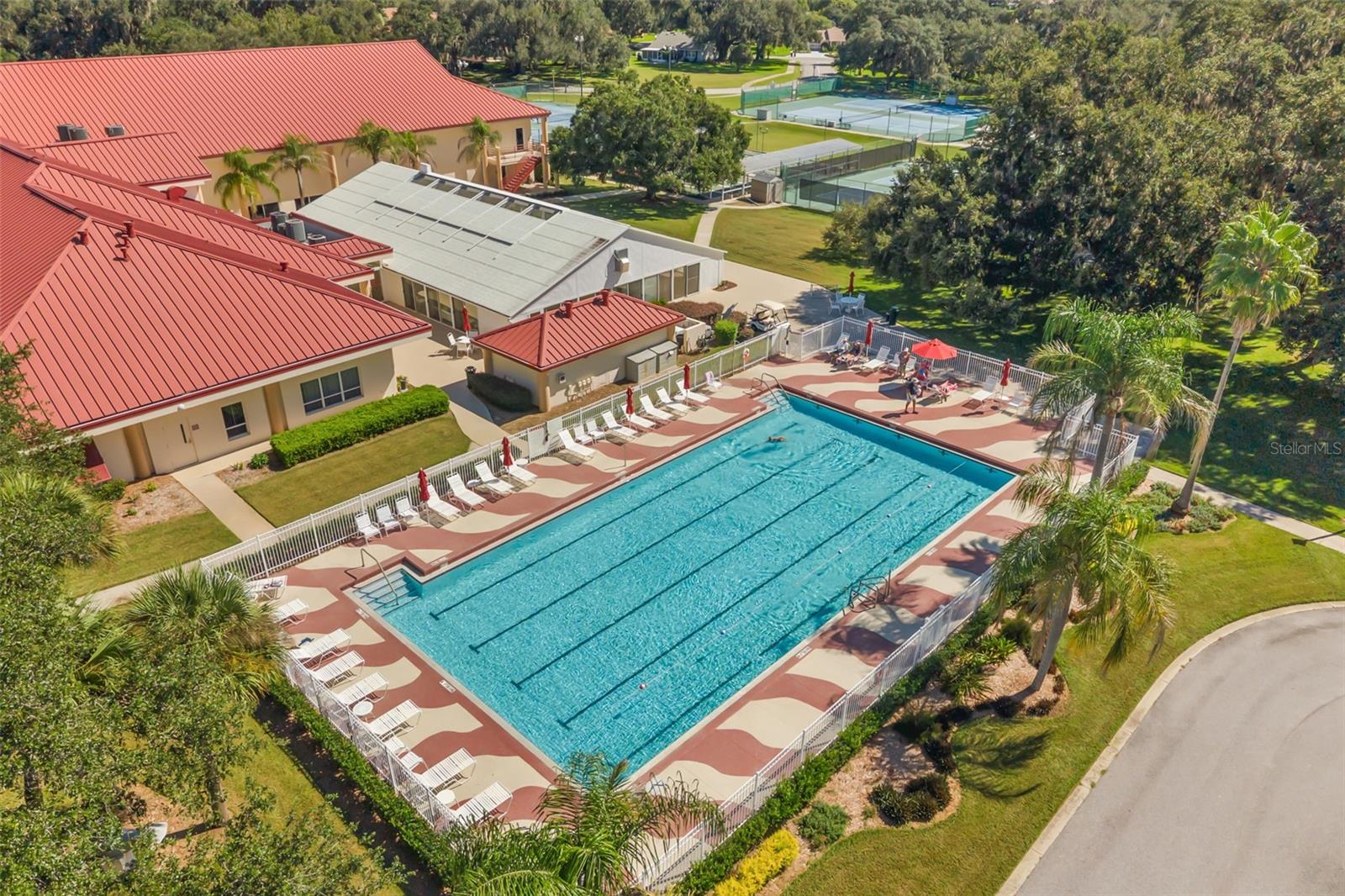 Clubhouse with outdoor pool, tennis, pickle ball and bocce ball courts