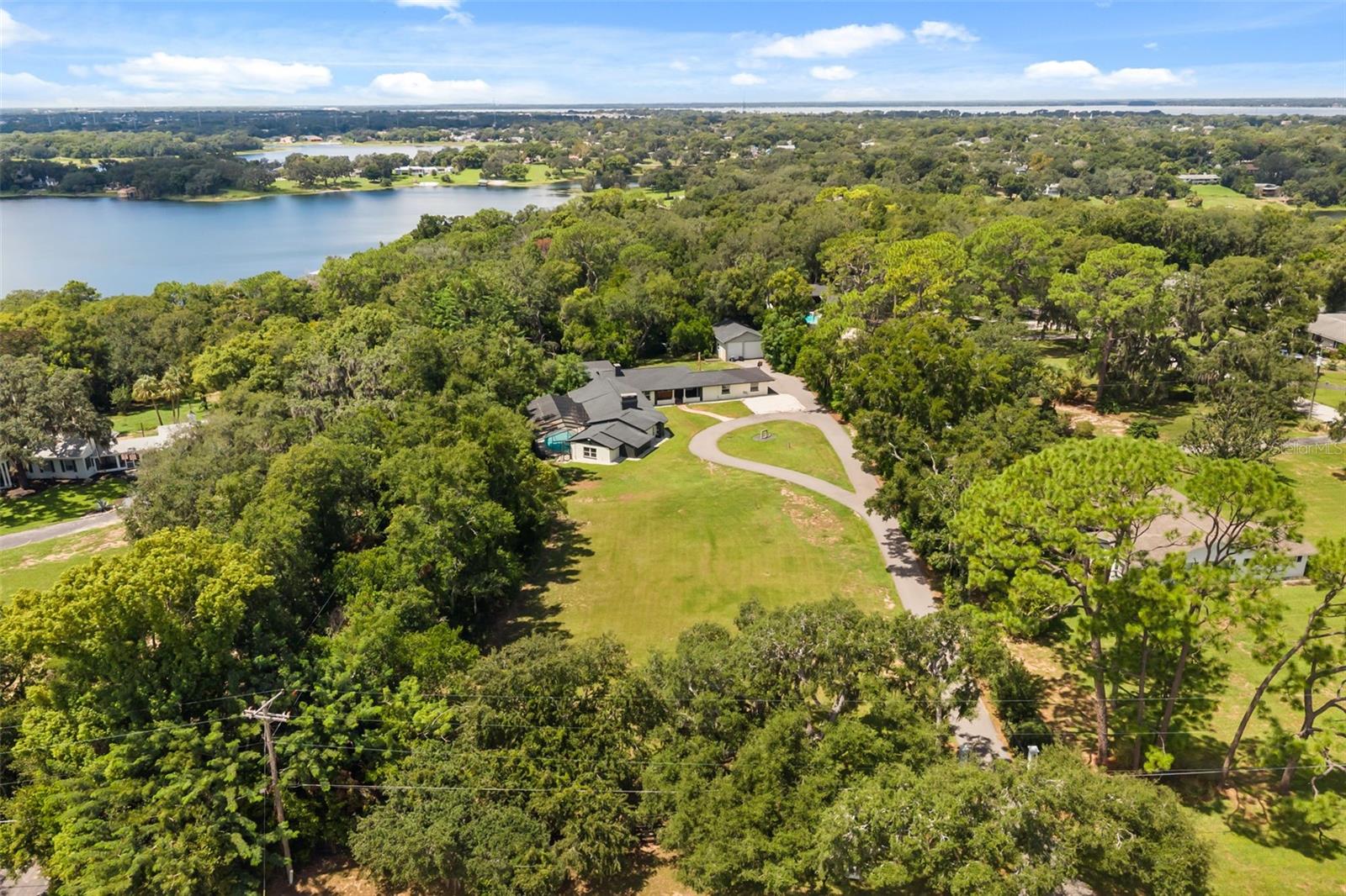 Aerial of property with East Crooked Lake in view