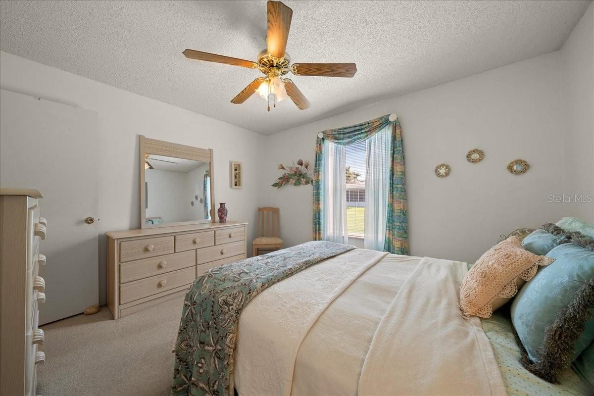 Guest Bedroom Features Ceiling Fan & Built-in Closet