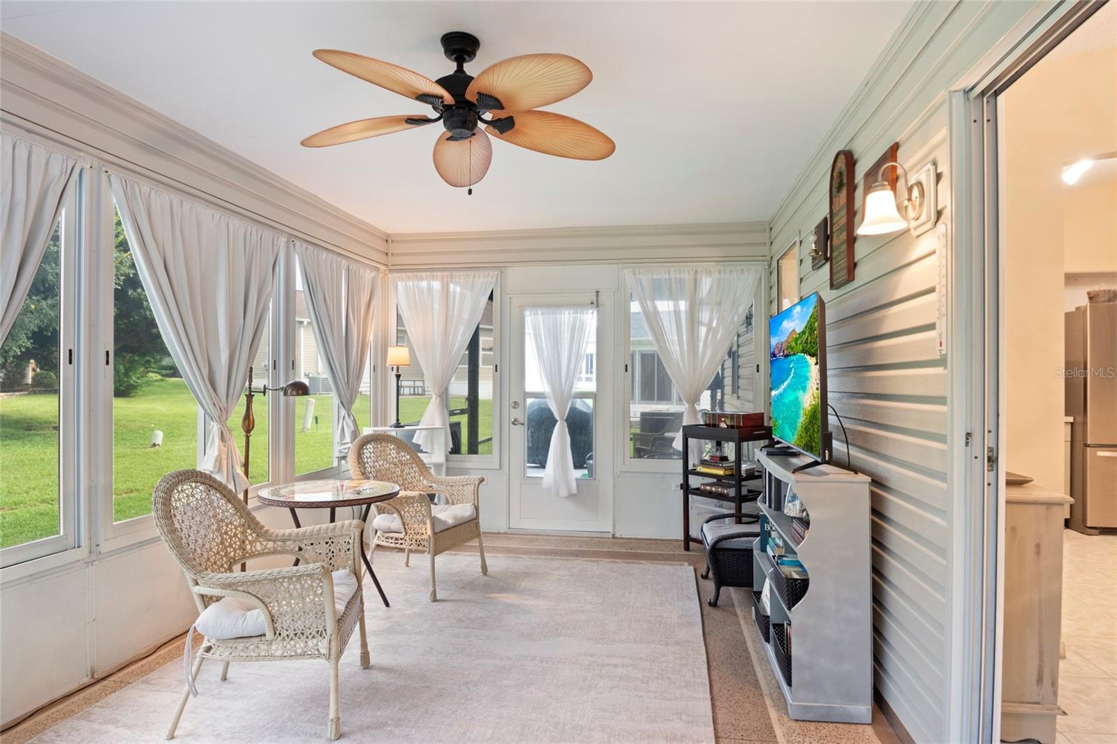 Specious Florida Room, painted concrete flooring.