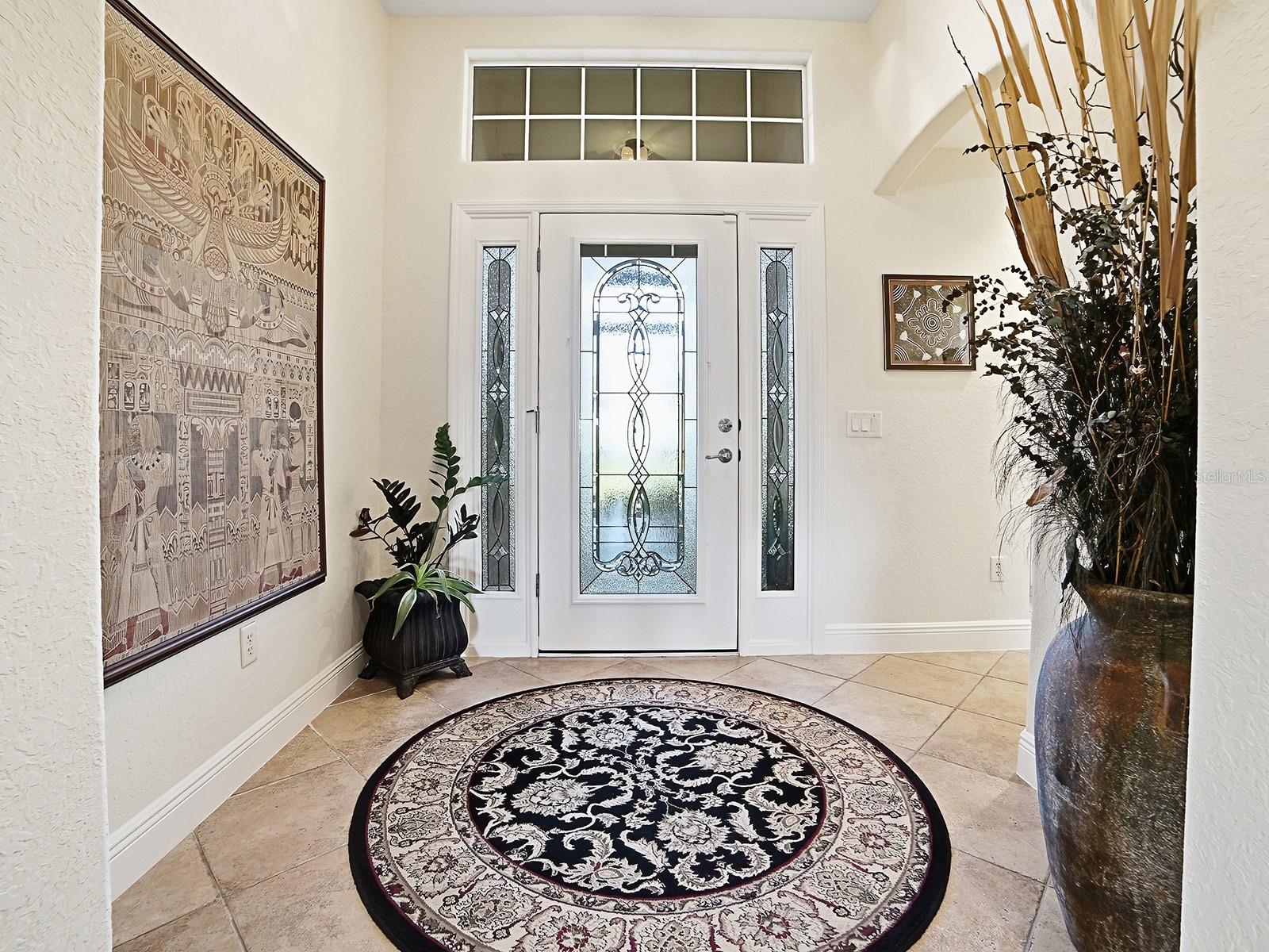YOUR GRAND ENTRYWAY WITH NATURAL LIGHT AND LEADED GLASS DOOR YOUR GRAND ENTRYWAY WITH NATURAL LIGHT AND LEADED GLASS DOOR