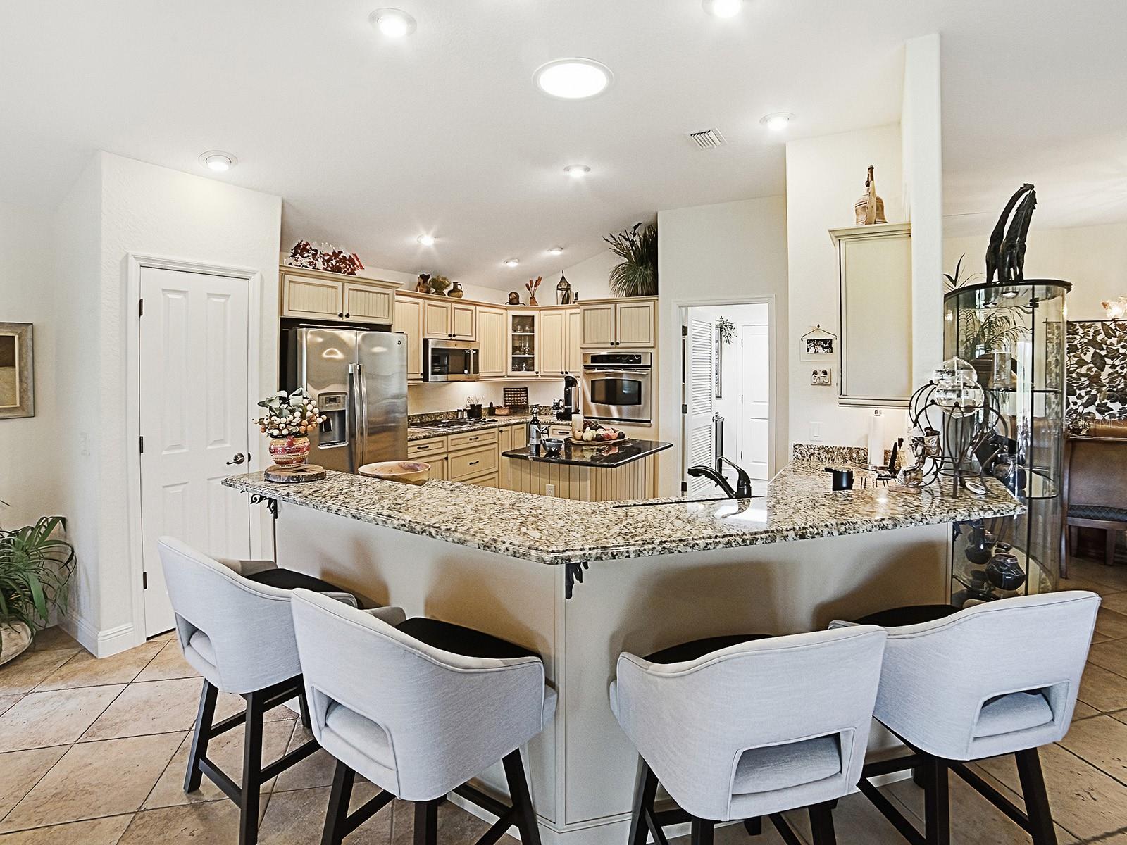 A STUNNING UPGRADED GOURMET KITCHEN