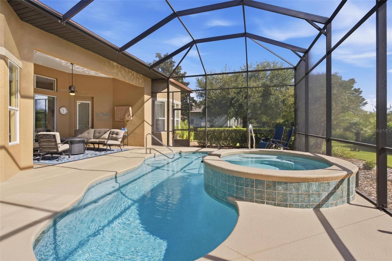 Complete view of pool area with multiple seating areas for you to relax in.