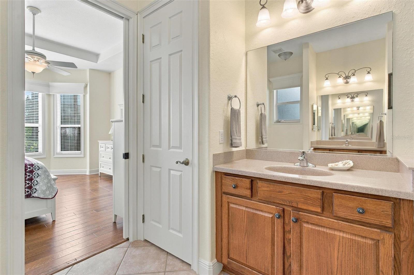 Primary bathroom with closet space.
