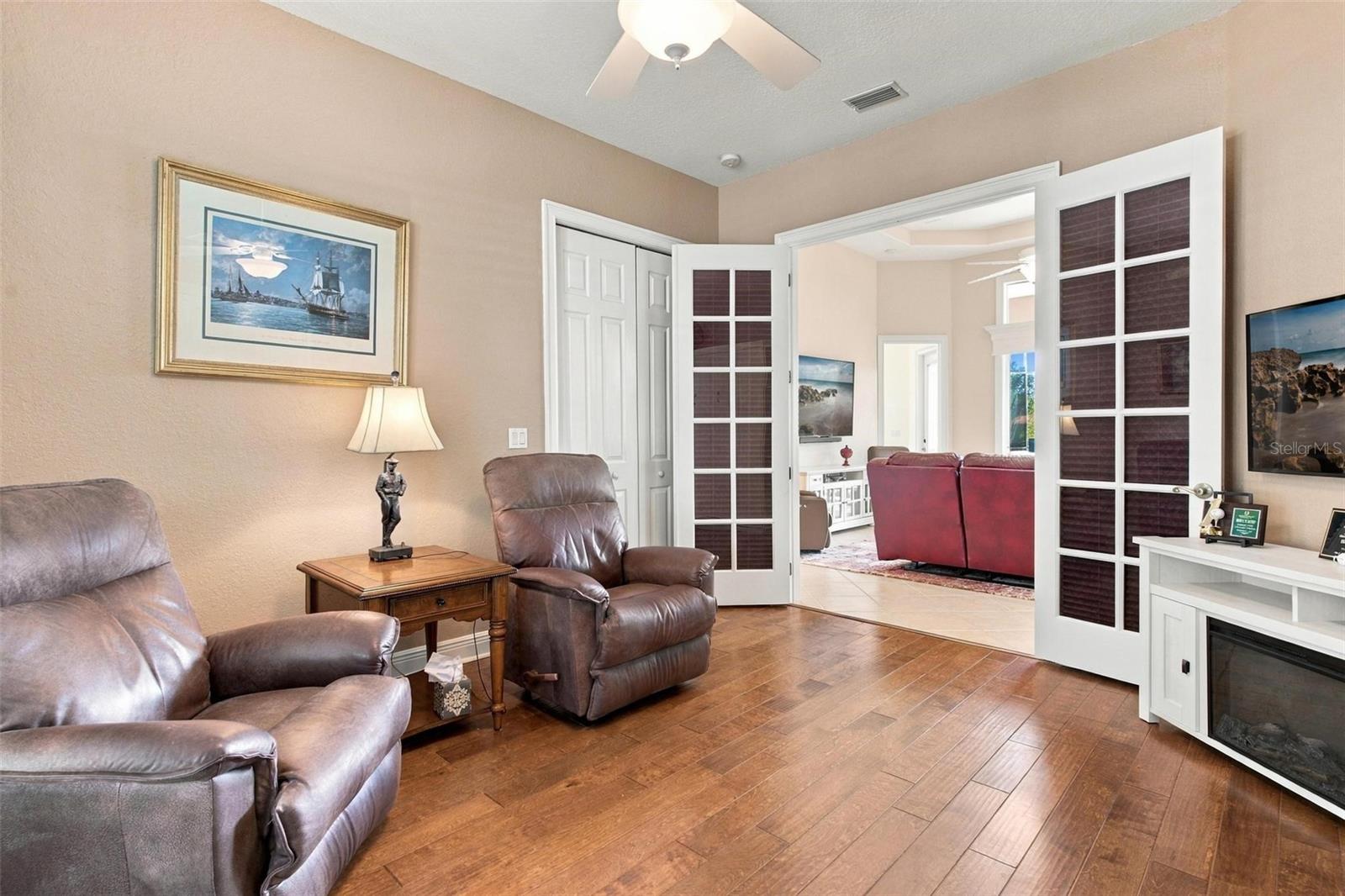 Third bedroom currently used as a sitting area.