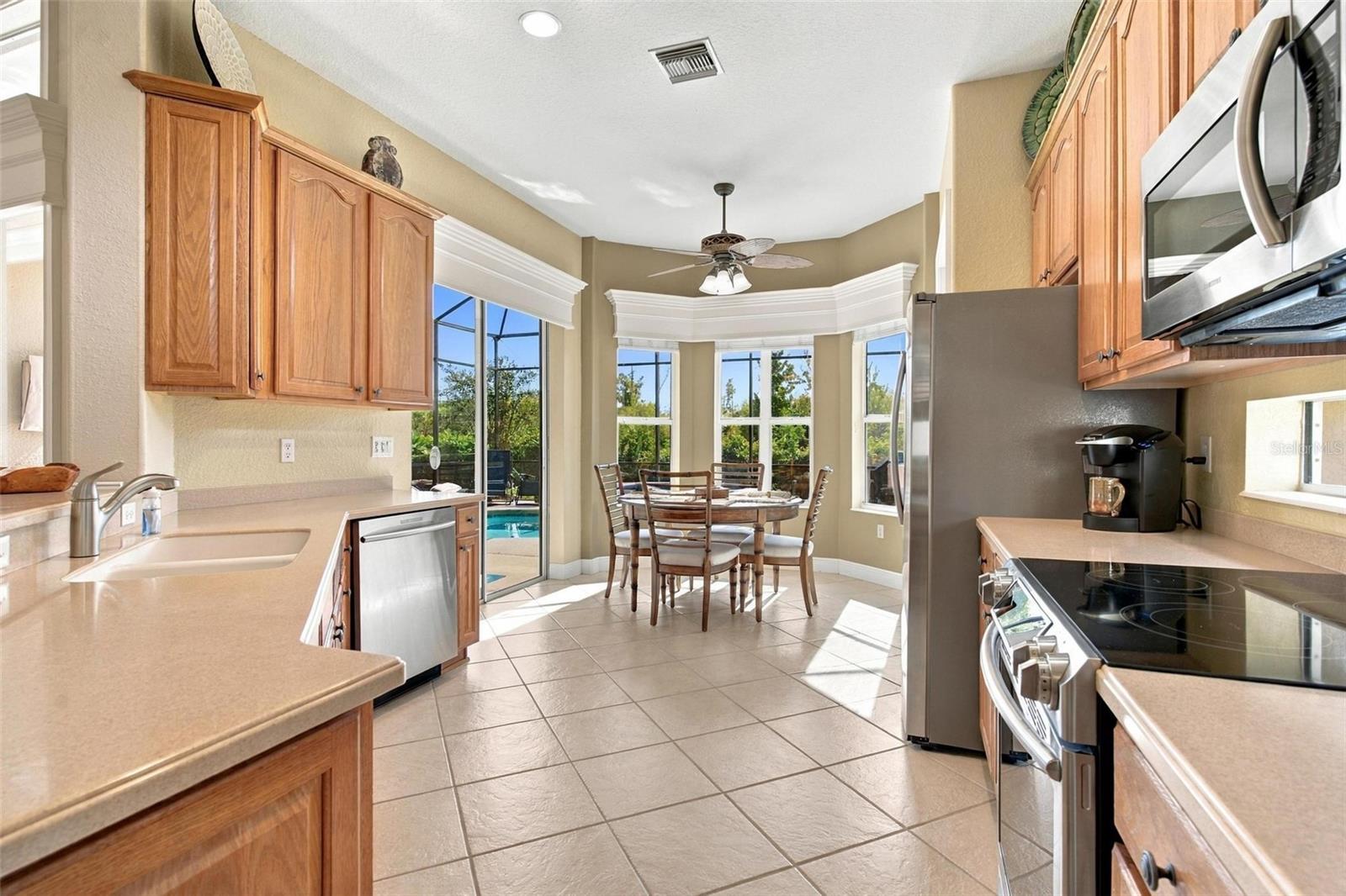 Beautiful kitchen with dinette...lot of cabinets for storage!