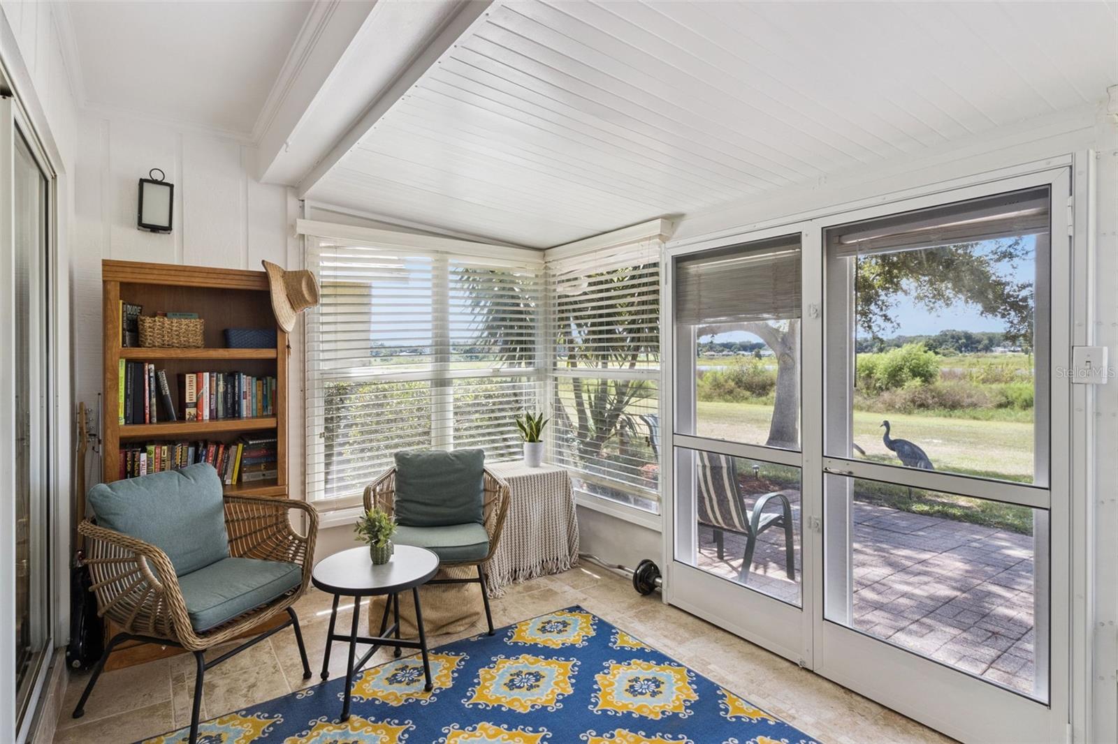 French doors with center-opening screens lead to the patio when you want the breeze.