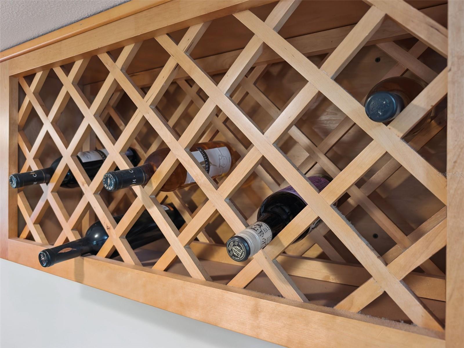 Built-in wine rack matches the rich tones of the wood cabinets.