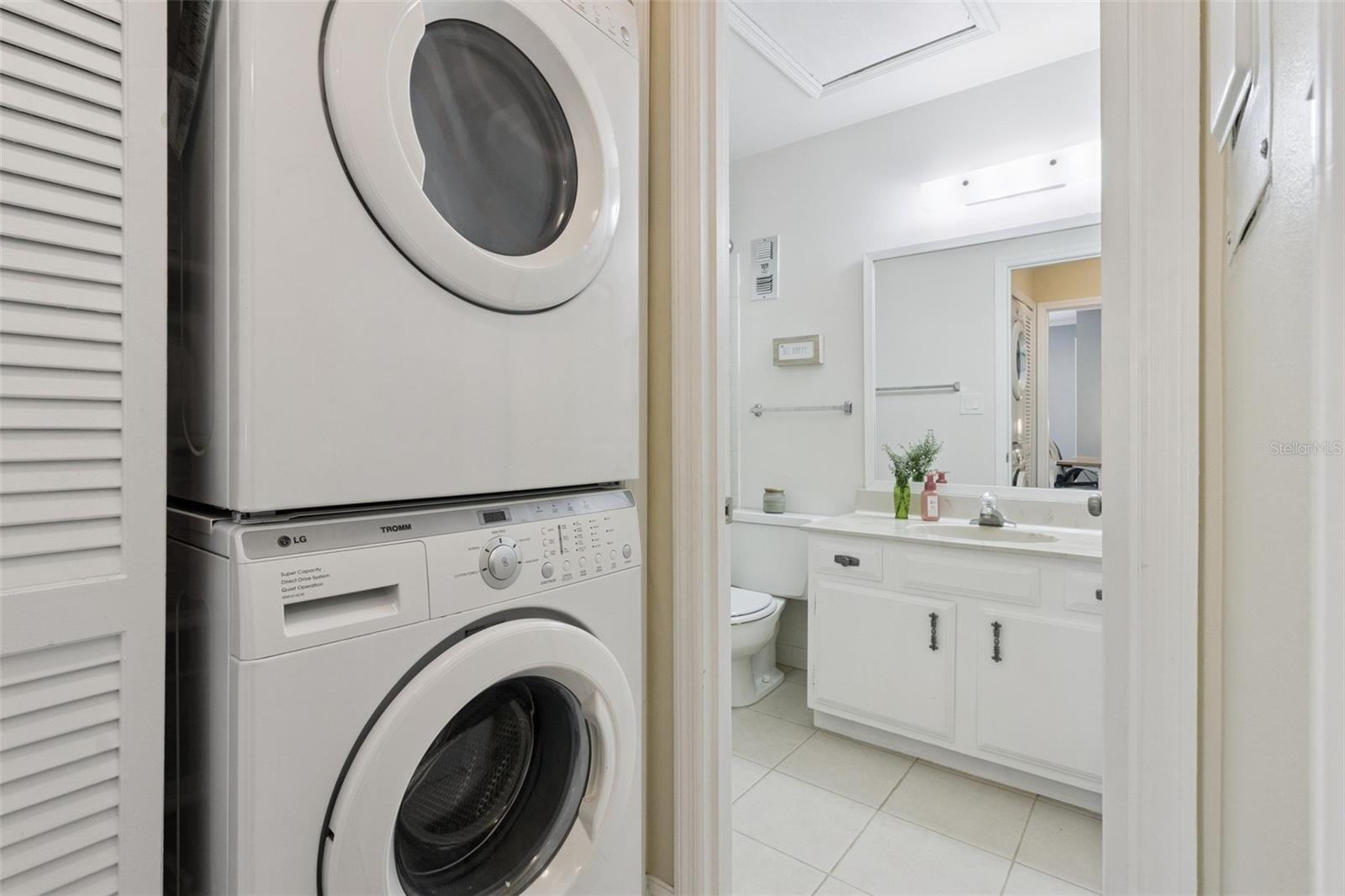 Washer/dryer closet is conveniently inside the home.