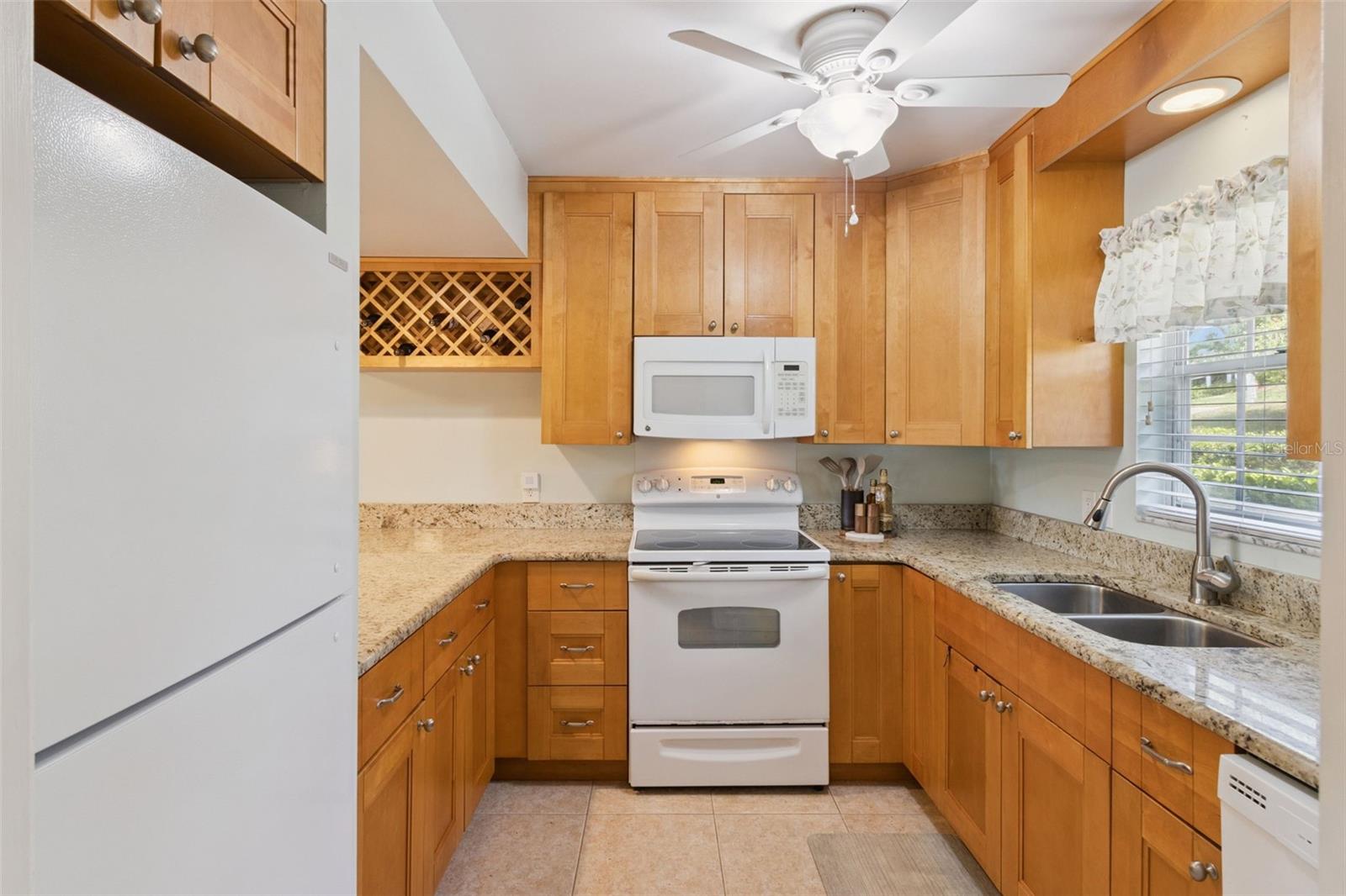 Richly endowed with gorgeous granite counters and a wealth of wood cabinets make this kitchen fun and functional. Richly endowed with gorgeous granite counters and a wealth of wood cabinets make this kitchen fun and functional.