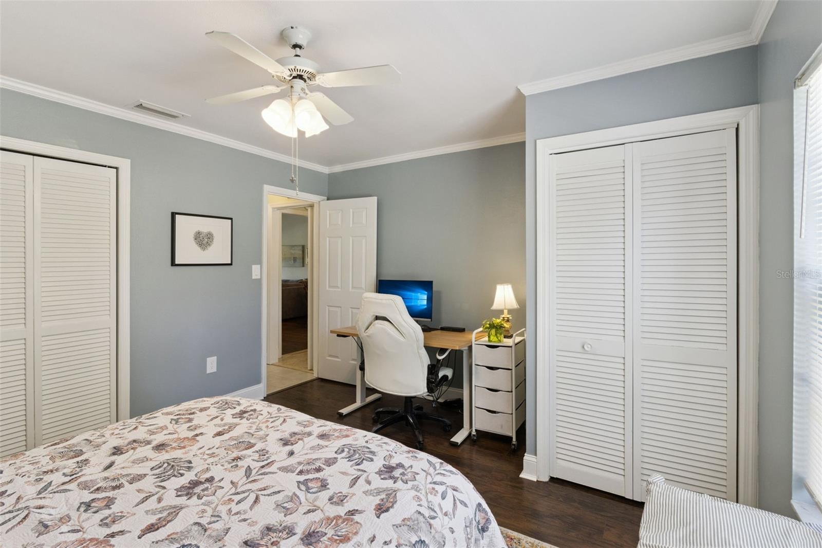 Secondary bedroom has two closets and no carpet.