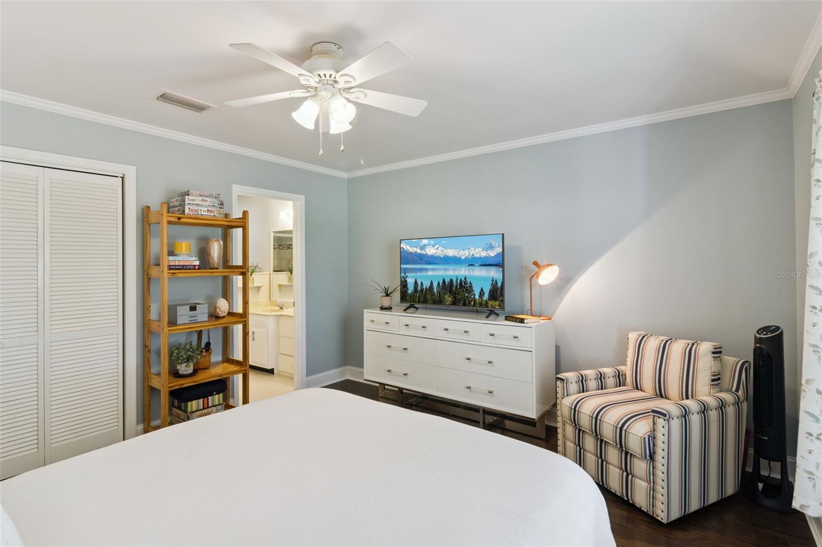 Primary bedroom is a comfortable haven with crown molding, no carpet, and full en suite bathroom. Primary bedroom is a comfortable haven with crown molding, no carpet, and full en suite bathroom.