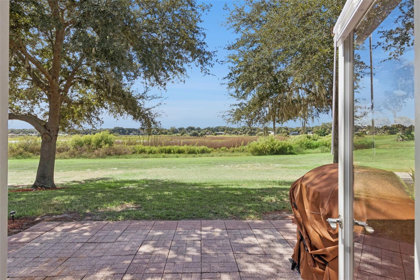 From your spacious paver patio, watch the glorious sunsets unfold over large Lake Alden.
