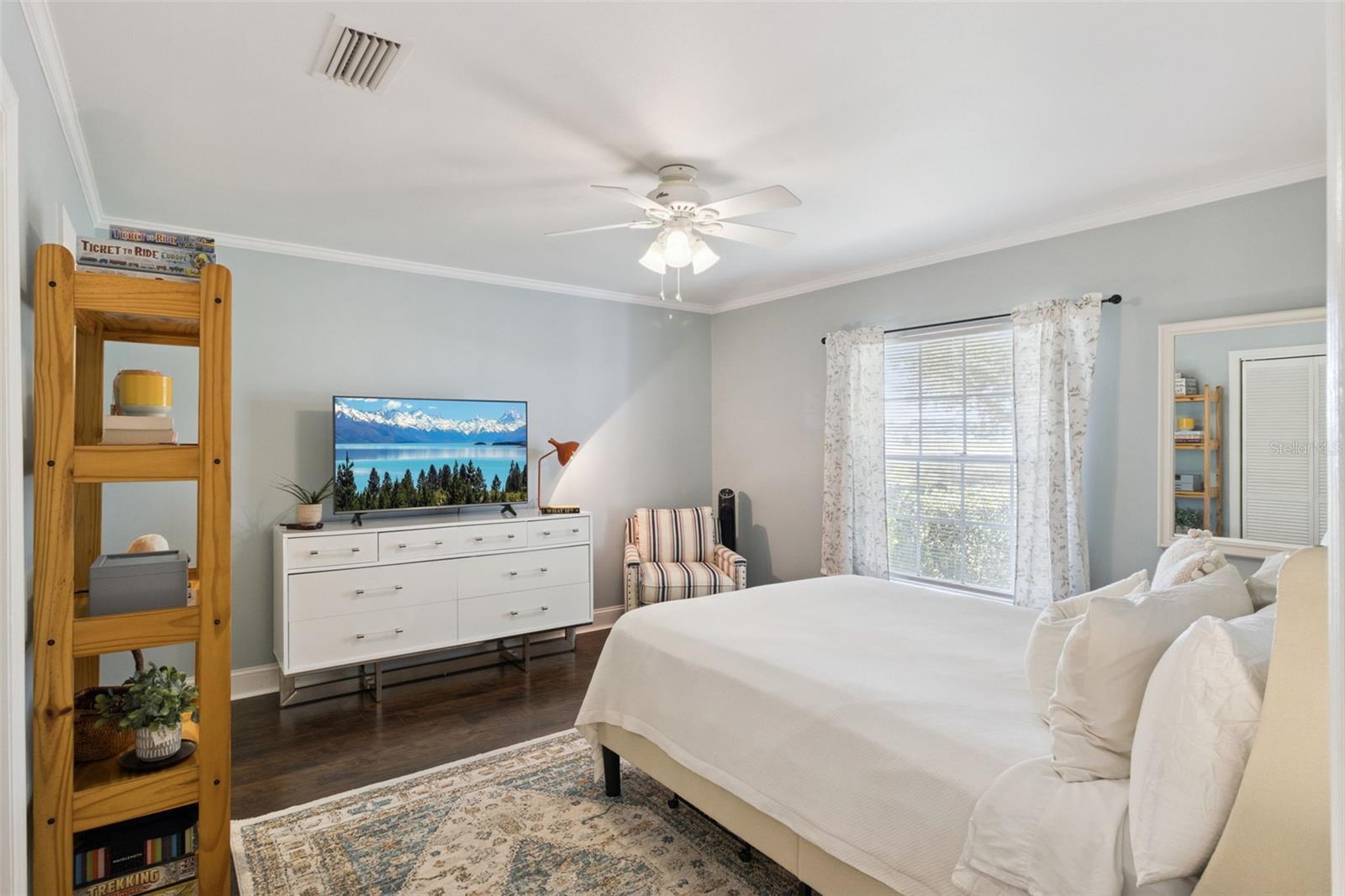 The roomy primary bedroom space includes a cozy reading nook.
