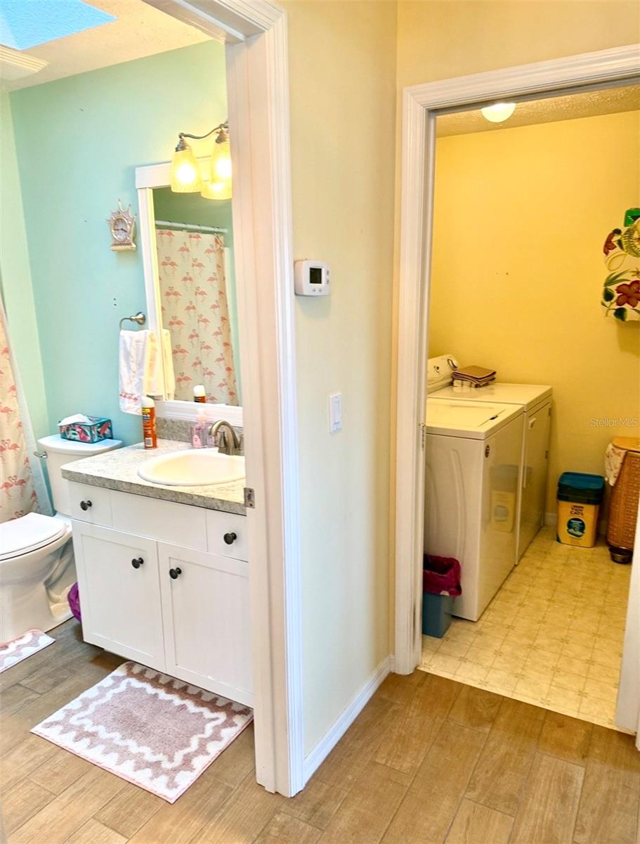 secondary bathroom and laundry room