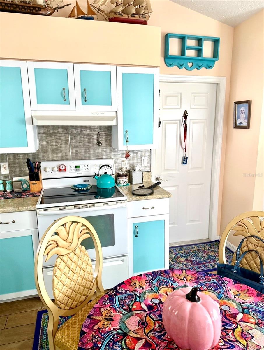 kitchen with view of door to garage