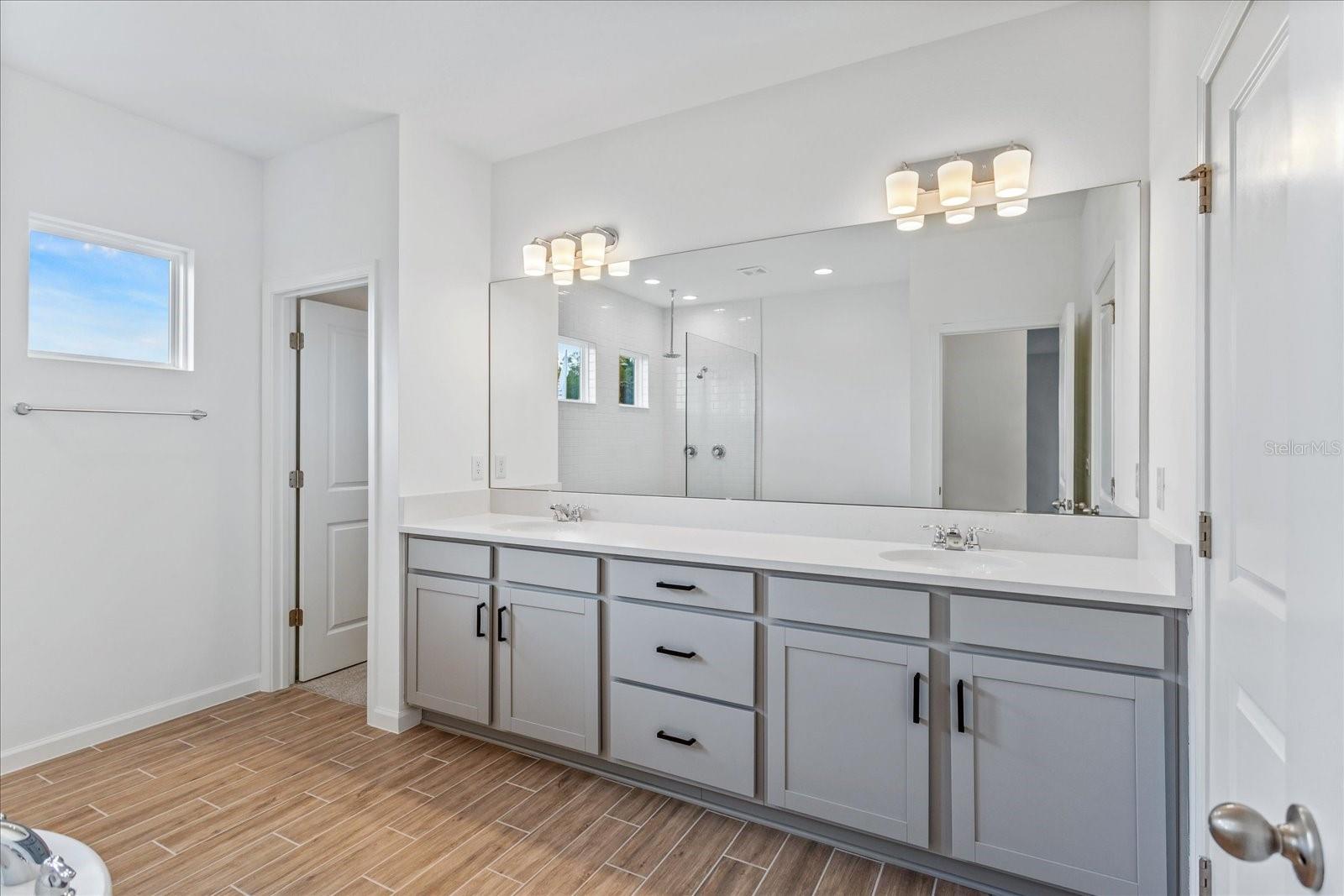 The sample photos included are of the model home and are meant to showcase the craftsmanship and design quality.