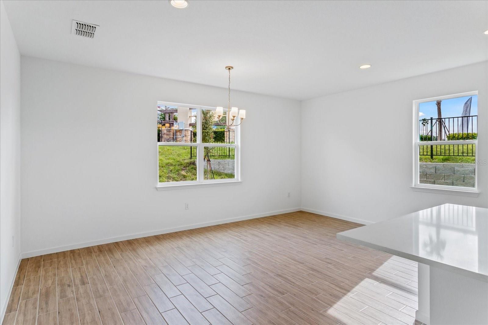 The sample photos included are of the model home and are meant to showcase the craftsmanship and design quality.