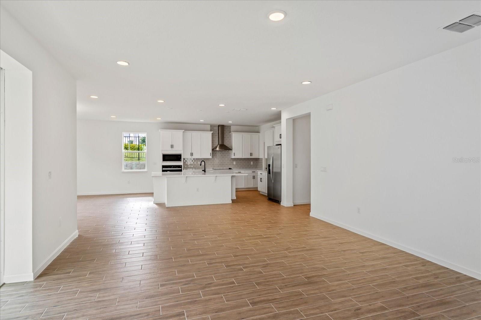 The sample photos included are of the model home and are meant to showcase the craftsmanship and design quality.