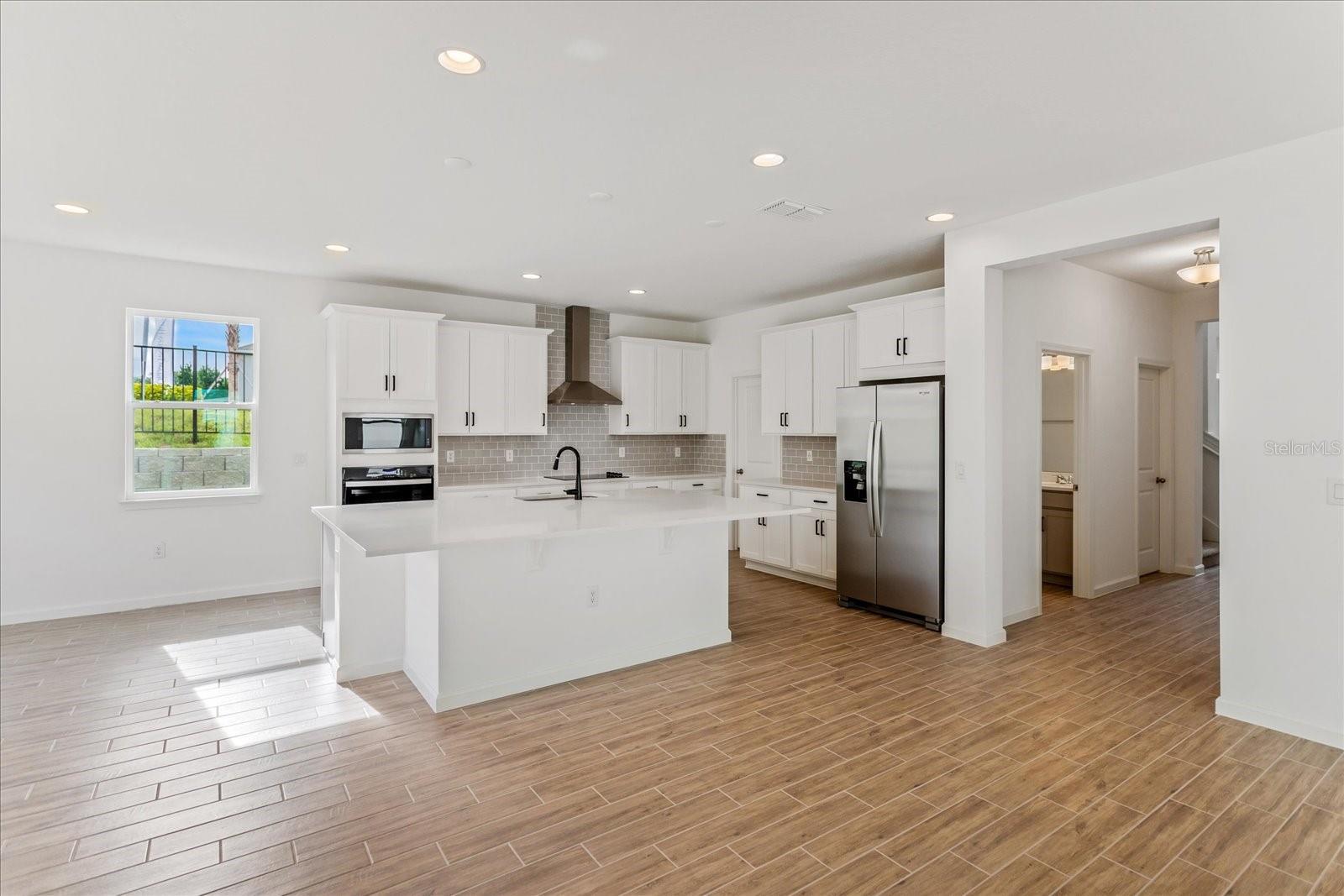 The sample photos included are of the model home and are meant to showcase the craftsmanship and design quality.