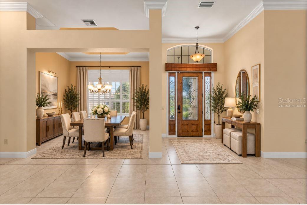 Virtually staged formal dining room.