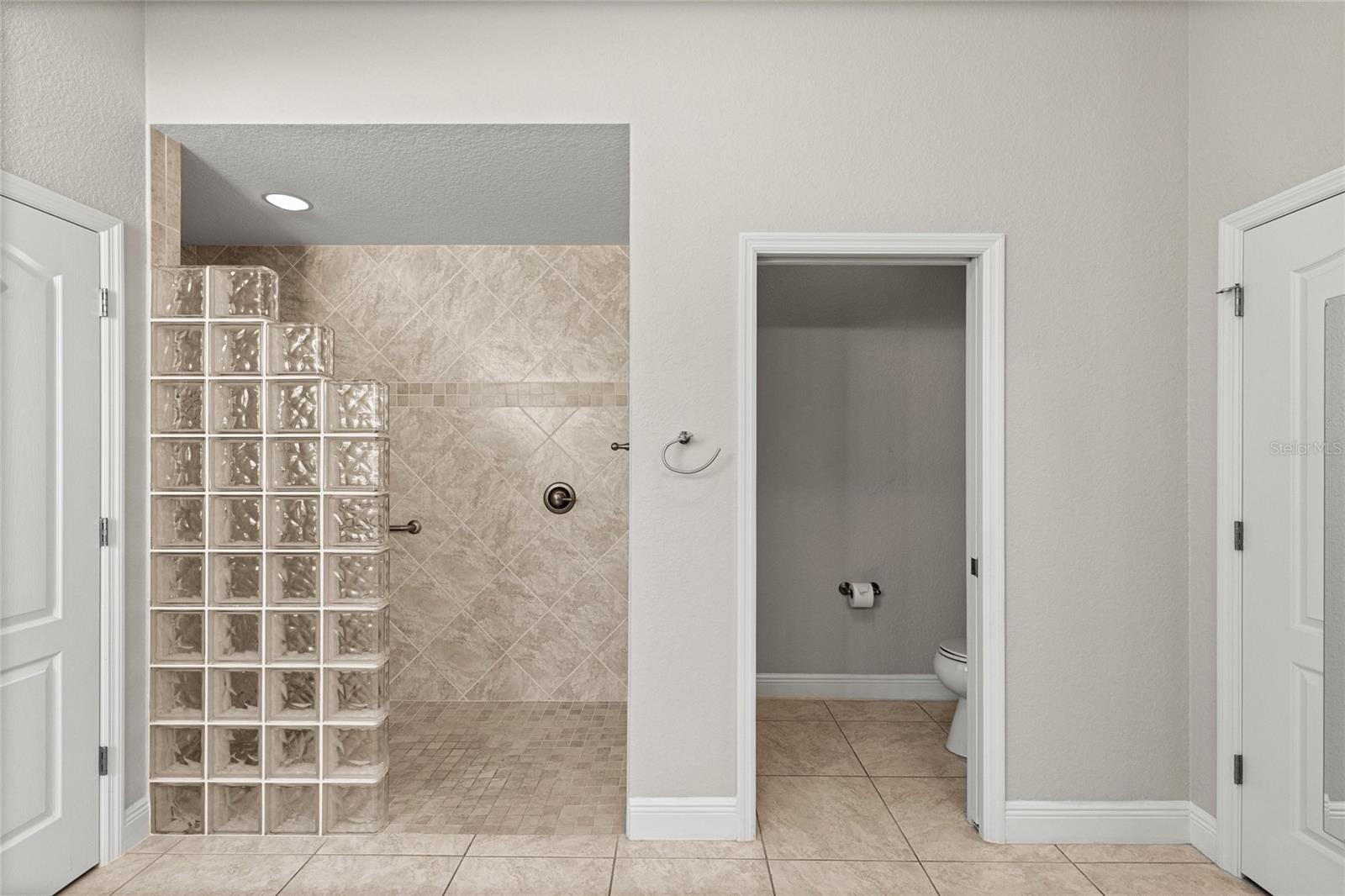 Spacious Roman Walk-In Shower.