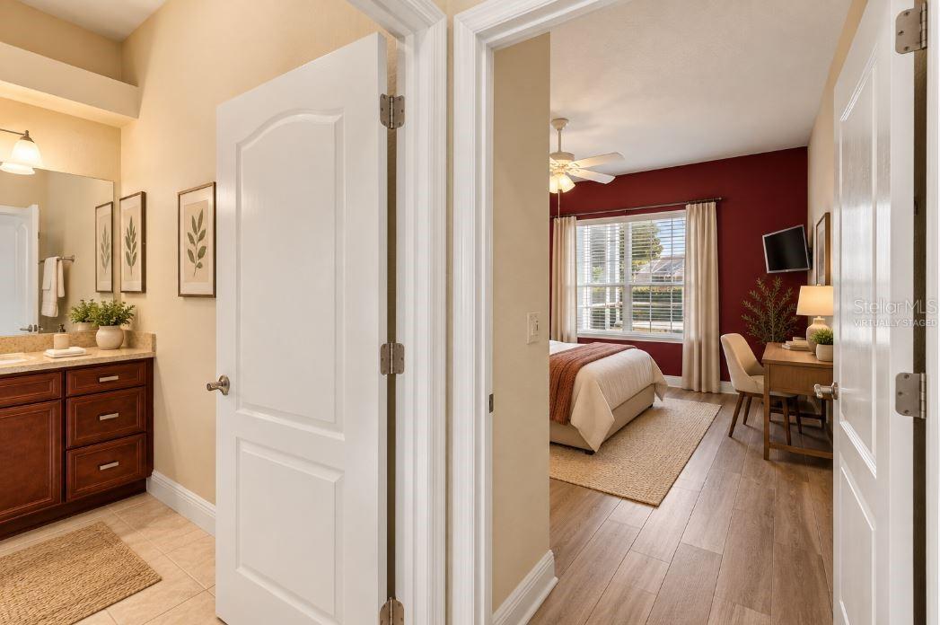 Virtually staged Hallway to guest bathroom/bedroom/office.